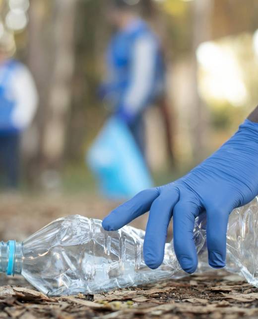 close-up-hand-holding-plastic-bottle
